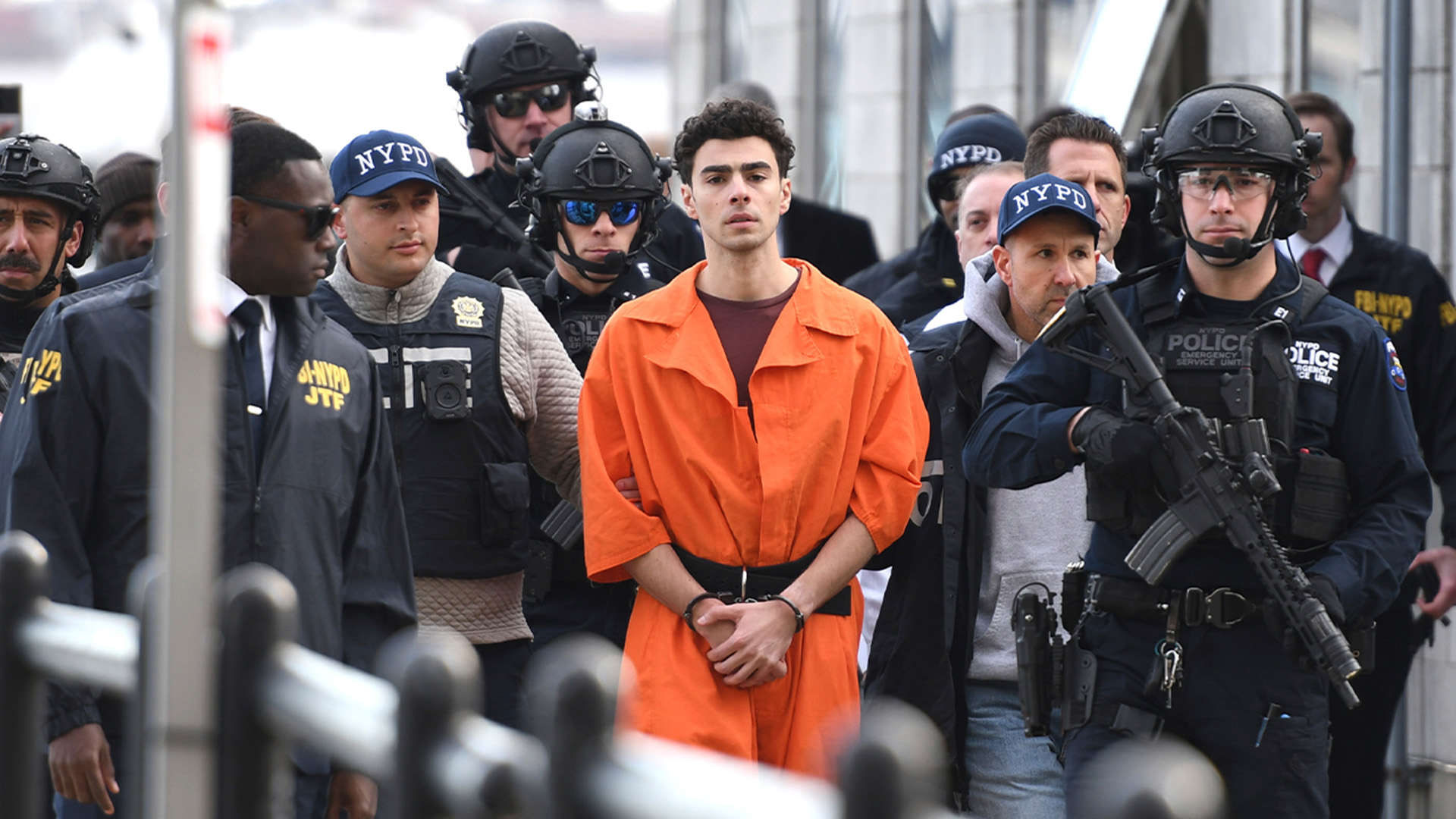 Luigi Mangione, a suspect in the fatal shooting of UnitedHealthcare CEO Brian Thompson, is escorted by police, Thursday, Dec. 19, 2024, in New York.